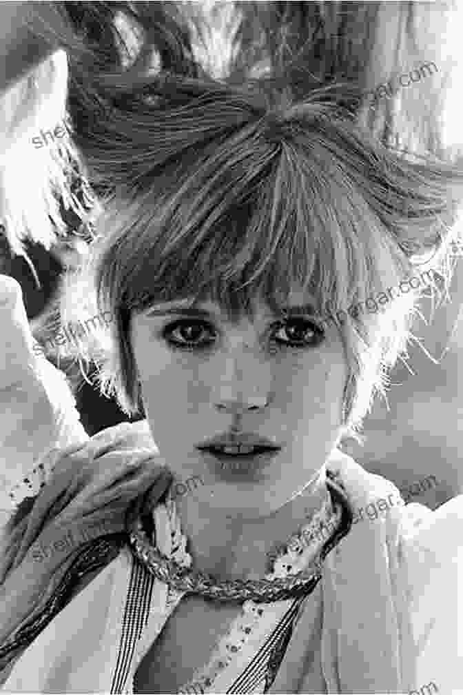 A Close Up Of Marianne Faithfull's Black And White Autobiography Cover, Showcasing Her Piercing Gaze And Enigmatic Smile. Faithfull: An Autobiography Marianne Faithfull