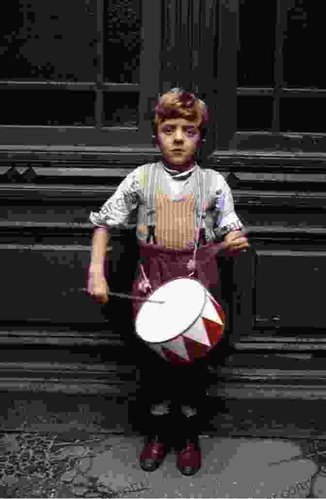 Oskar Matzerath Playing His Tin Drum, A Symbol Of His Rebellion And Childish Defiance The Tin Drum Gunter Grass